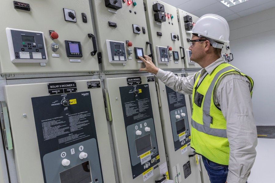technician servicing power generation equipment